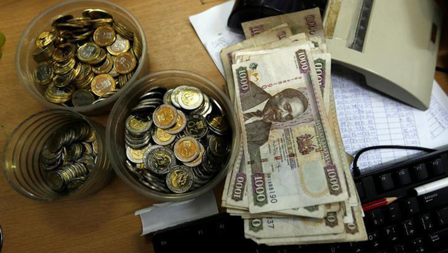 Kenya shilling coins and notes are pictured inside a cashieru2019s booth at a forex exchange bureau. Net.