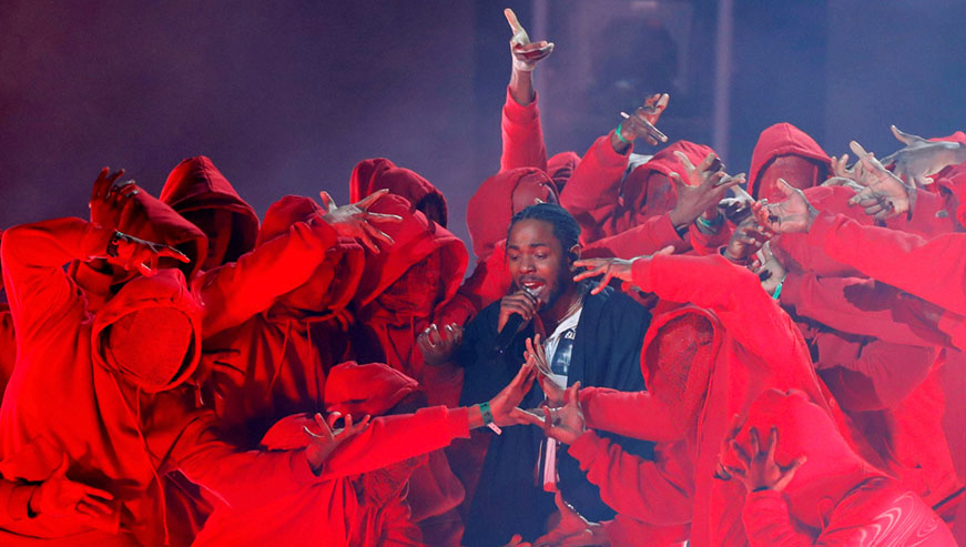 Kendrick Lamar performs at the Grammy Awards earlier this year. Is it appropriation if African Americans draw influence from Africa? Net  photos.