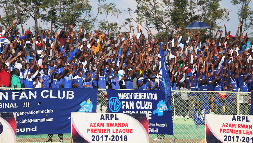 Supporters cheer on players after scoring the goal
