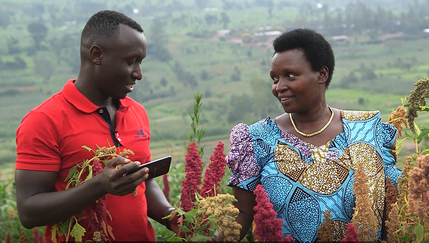 Habiyaremye with his mother Agnes Mukankwaya in her quinoa field in Ngoma District. Donah Mbabazi.