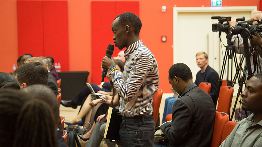 Collins Mwai, reporter of the New Times asks questions during the press briefing yesterday. Nadege Imbabazi