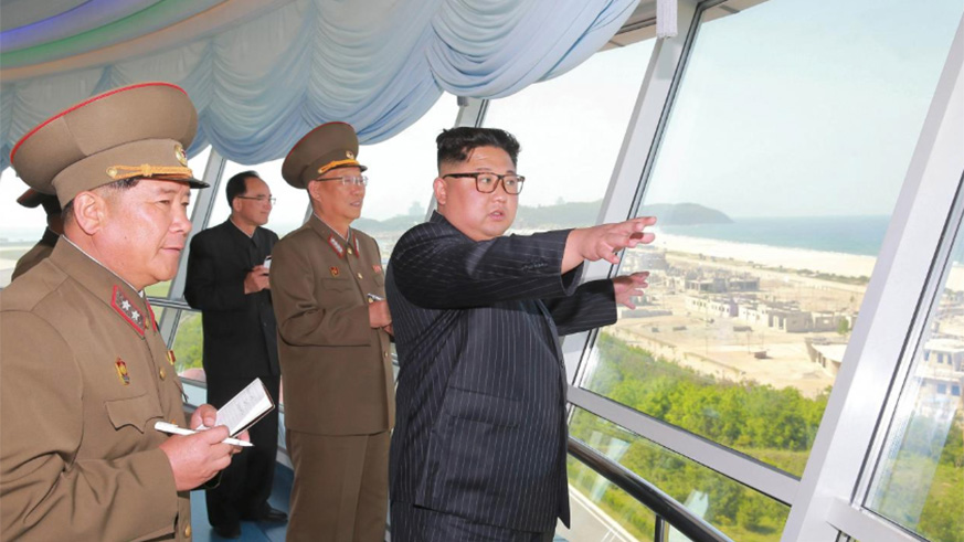 North Korean leader Kim Jong Un inspects the construction site of the Wonsan-Kalma coastal tourist area as Kim Su-gil (3rd L), newly appointed director of the General Political Bureau of the Korean People's Army, looks on, in this undated photo released by North Korea's Korean Central News Agency (KCNA) in Pyongyang. / Internet photo