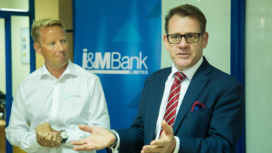 The Managing Director of I&M Bank, Robin Bairstow, speaks during the launch of SPENN as Blockbonds CEO Jens Glaso listens. Nadege Imbabazi. 