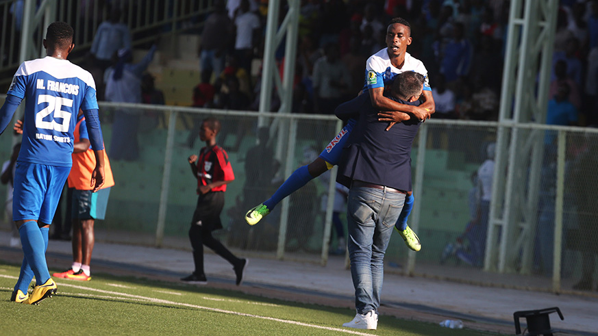 Rayon Sports winger Eric Rutanga and his coach Ivan Minnaert celebrate the goal during a 1-all draw against Police FC. / Sam Ngendahimana