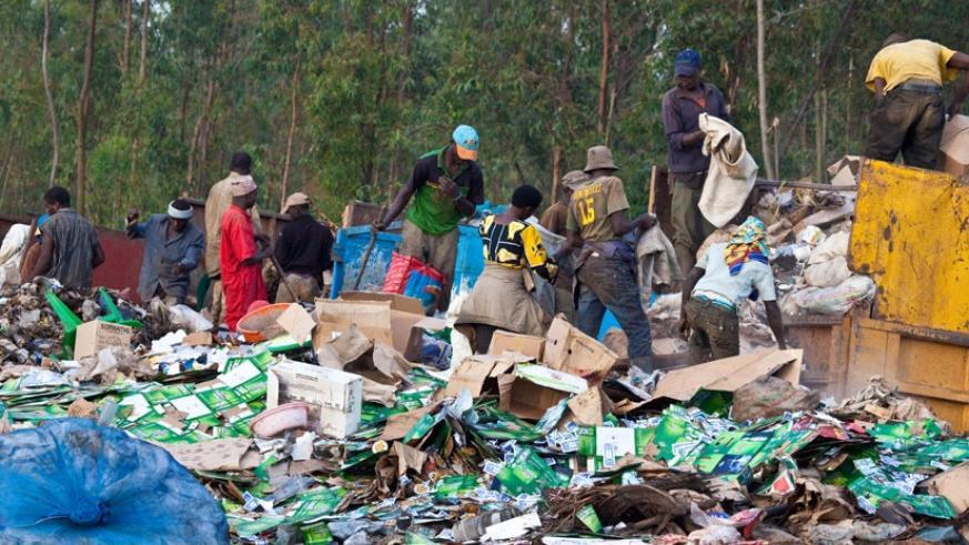 Workers sort gabbage at Nduba dump site in Gasabo District. File.