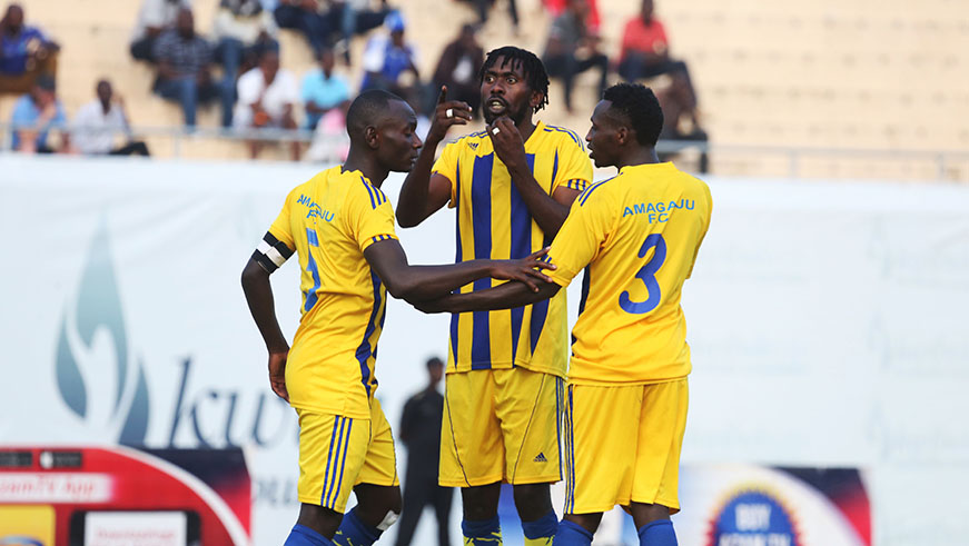 Amagaju' DieudonnÃ© Munezero (C) scored the second goal , seen here chats with his teammates during the match