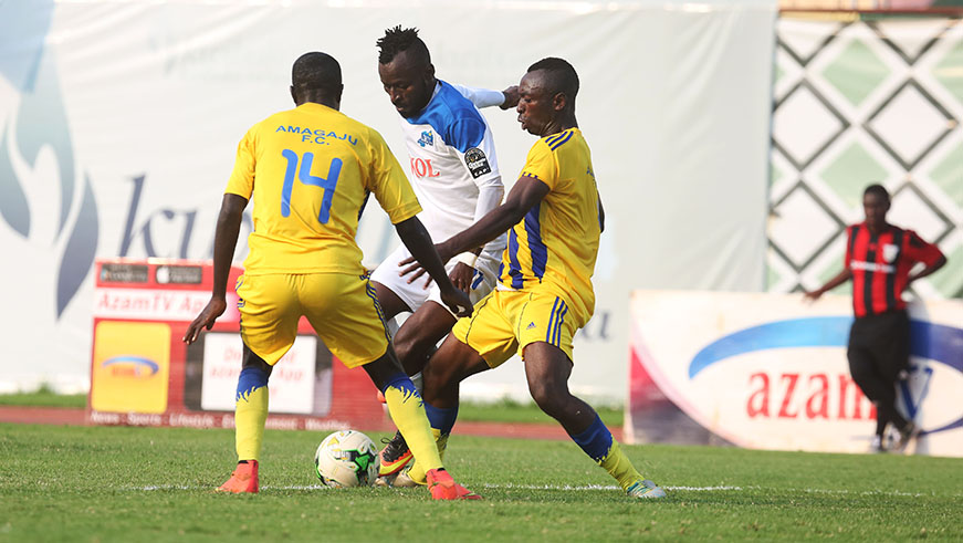 Former Amagaju FC forward Shaban Hussein Tchabalala beats for the ball defenders in the first half AT Amahoro National Stadium