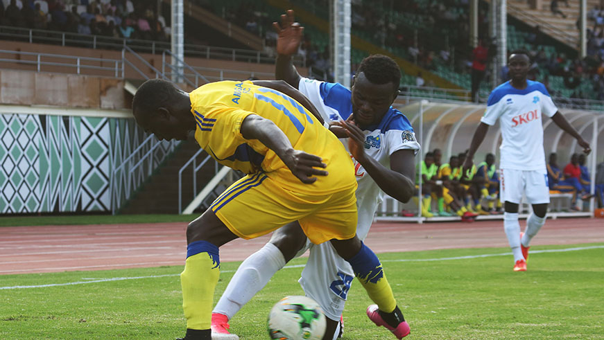 The Blues goal scorer Djabel Imanishimwe battles for the ball Hussein Utaka during the match