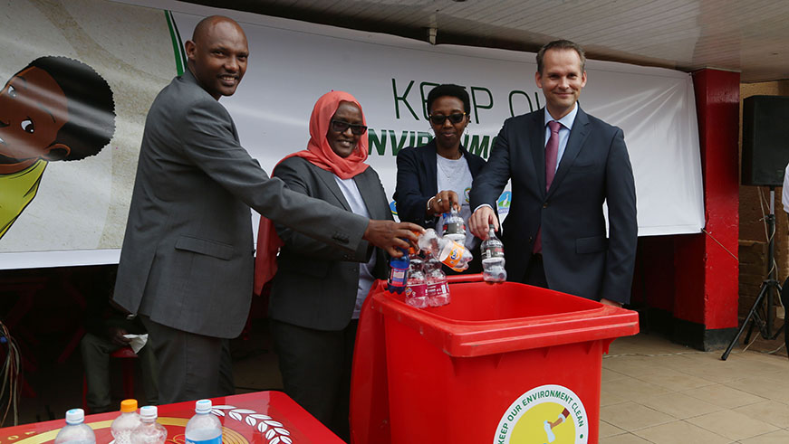 Officials from the Ministry of Environment, REMA, Bralirwa and COOPED at the launch of plastic pollution  collection system to increase PET collection points around the country, yesterday. Sam Ngendahimana.