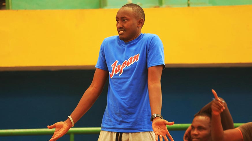 Rwanda Basketball head coach Maxime Marius Mwiseneza in action during the match (Sam Ngendahimana)