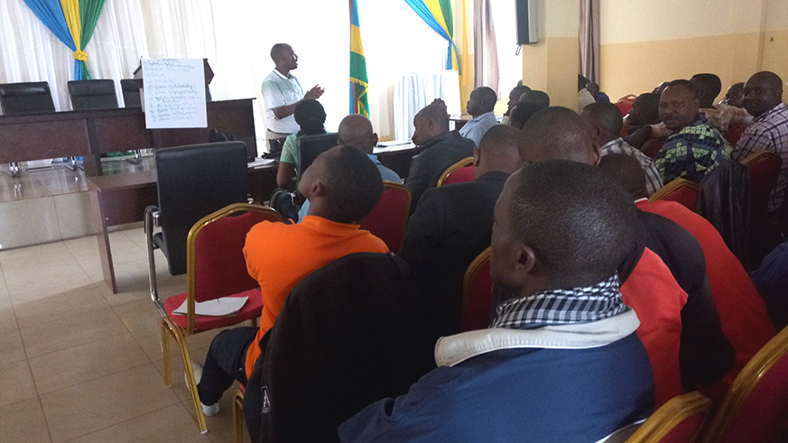 RCAâ€™s Chief Cooperative Inspector in the City of Kigali, Abdul Wahab Ntaganda (in front) while training motor driver cooperative leaders from Gasabo District on Friday, June 8, 2018 (E. Ntirenganya)