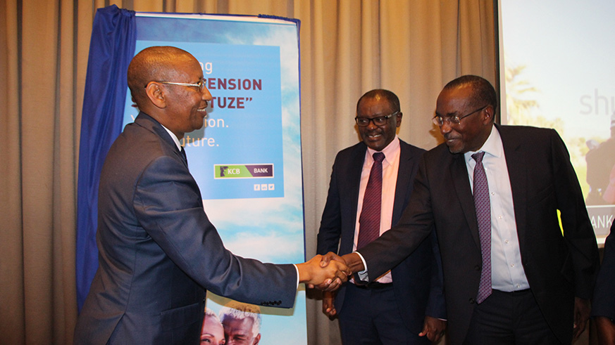 Liaison Group Chairman Wachira Mahihu looks on as Govenor John Rwangombwa shakes hands with George Rubagumya, the Executive Director of the Group, after launching the groupu2019s Private pension scheme. Courtesy