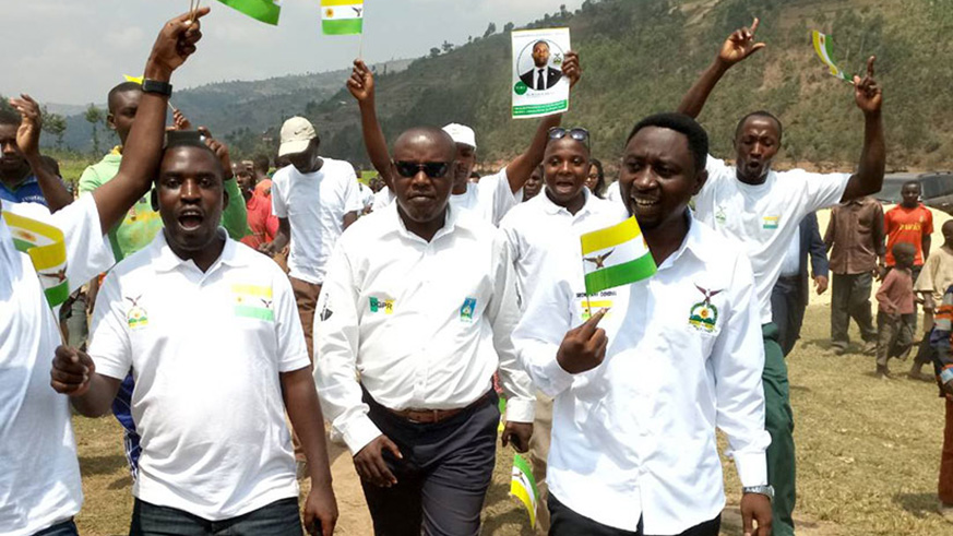 Frank Habineza, of the Democratic Green Party (right) and his supporters, during a presidential campain last year. Green Party targets 20% of seats in the upcoming parliamentary elections. File.