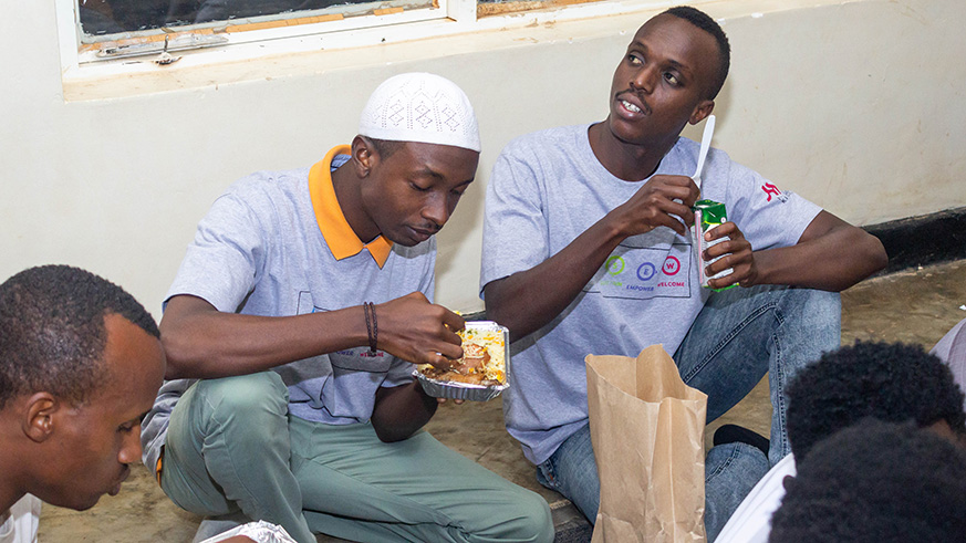 The hotel management and staff share Iftar with the Muslim community in Nyamirambo. all photos by Joseph Mudingu.