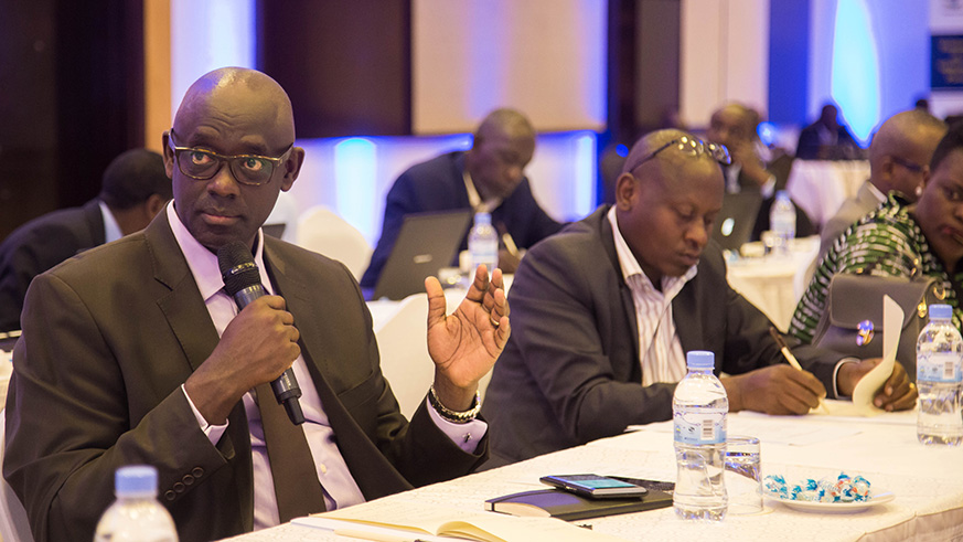 The Minister for Justice Johnston Busingye makes an intervention during the consultative meeting yesterday. Nadege Imbabazi.