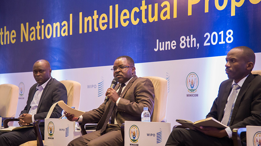 The Minister for Trade and Industry, Vincent Munyeshyaka (C), addresses participants during the national intellectual policy workshop yesterday, as Jean Marie Twagirayezu, from Rwanda Investigation Bureau (L), and Richard Kayibanda, the Registrar General at RDB, look on. Nadege Imbabazi. Nadege Imbabazi.