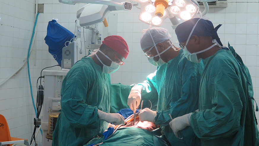Doctors performing laparoscopic surgery in a theatre at CHUK. Eddie Nsabimana.