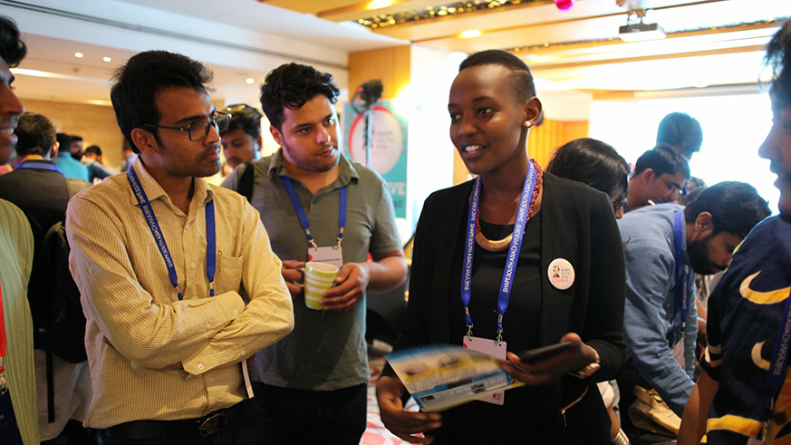 The writer explains her project to fellow Shapers during an exhibition. courtesy