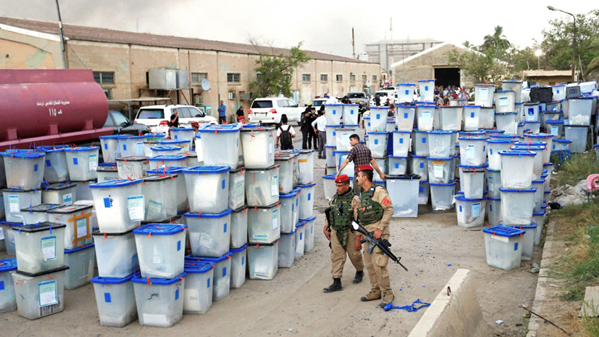 Ballot boxes are seen after the fire in the  warehouse in  al-Rusafa district. Net photo.