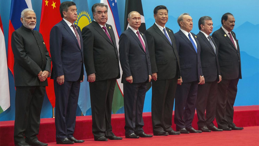 Russian President Vladimir Putin is seen during a photo session of the SCO (Shanghai Cooperation Organisation) Heads of State ahead of a meeting of the SCO Council of Heads of State in Qingdao, China June 10, 2018. (L-R): Prime Minister of the Republic of India Narendra Modi, President of the Kyrgyz Republic Sooronbay Jeenbekov, President of the Republic of Tajikistan Emomali Rahmon, Russian President Vladimir Putin, President of the People's Republic of China Xi Jinping, President of the Republic of Kazakhstan Nursultan Nazarbayev, President of the Republic of Uzbekistan Shavkat Mirziyoyev and President of Republic of Pakistan Mamnoon Hussain. / Internet photo