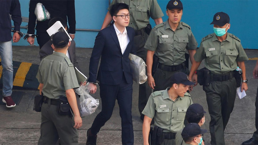 Pro-independence activist Edward Leung walks inside a detention centre before leaving for the High Court for a sentencing hearing in Hong Kong. / Internet photo