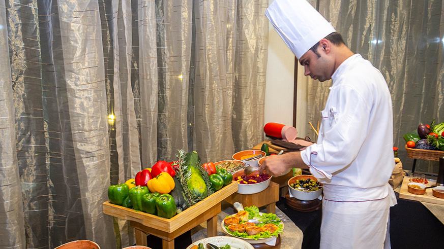A chef at Kigali Marriott sets up a fruit buffer at the wine event.