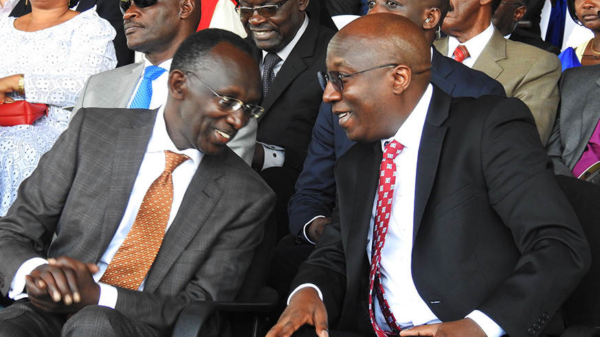 Prime Minister Edouard Ngirente chats with Chief Justice Sam Rugege during enthroning ceremony of new Anglican Archbishop. / Frederic Byumvuhore