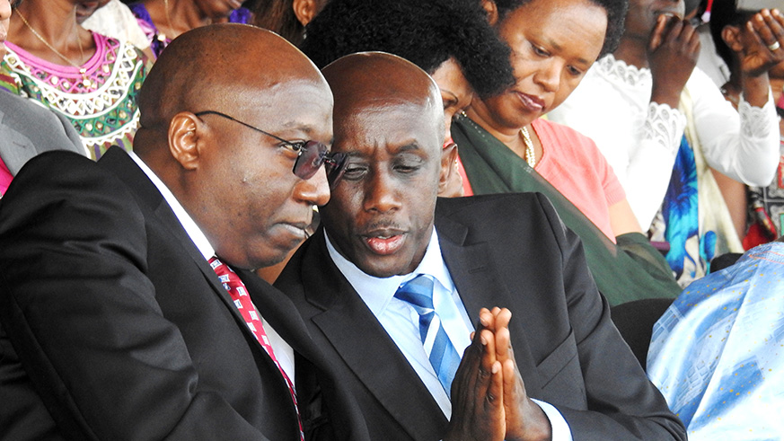 Prime Minister Edouard Ngirente chats with the Minister of Local Government Francis Kaboneka during enthroning ceremony of new Anglican Archbishop. / Frederic Byumvuhore