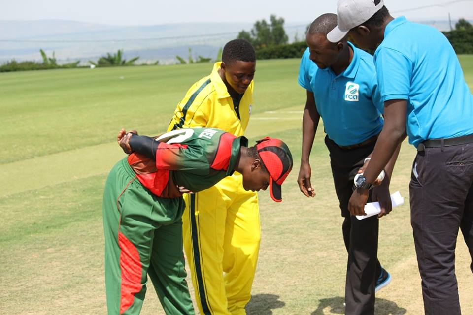 Match officials and captains of both teams after the toss. 
