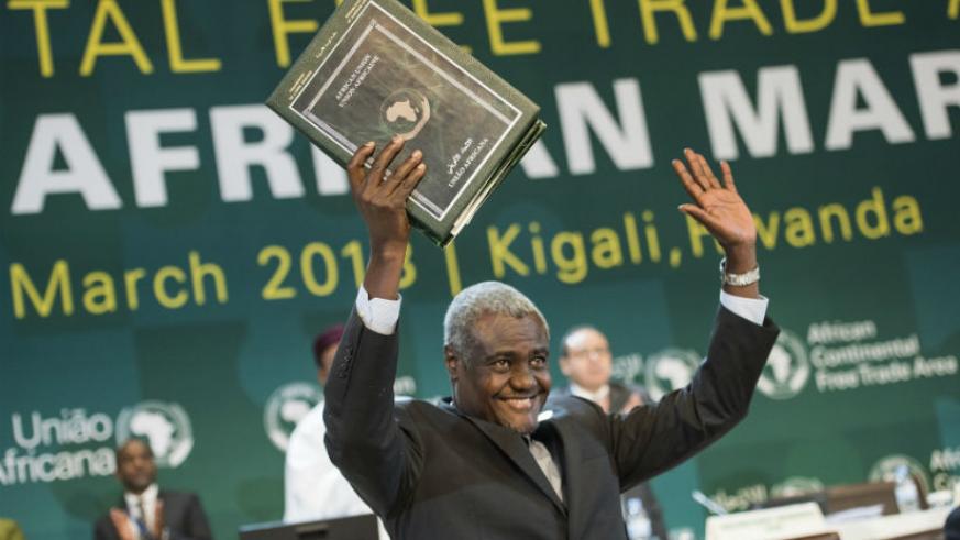 The Chairperson of the African Union Commission Moussa Faki Mahamat holds the instruments after they were signed by the heads of state and representatives from various African countries. Courtesy.