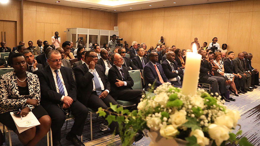 Diplomats listen to Venuste Karasira's testimony during the event in Kigali
