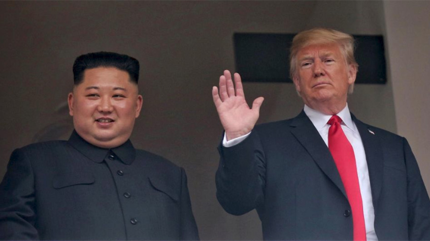 U.S. President Donald Trump waves next to North Korean leader Kim Jong Un at the Capella Hotel on Sentosa island in Singapore. / Internet photo