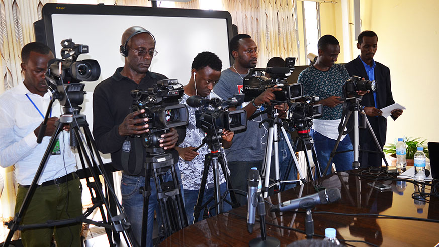 Rwandan journalists capture images during a press conference in Kigali .Sam Ngendahimana.