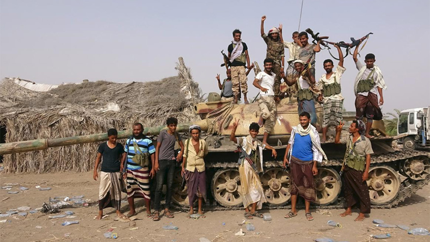 Tribal fighters loyal to the Yemeni government stand by a tank in al-Faza area near Hodeida, Yemen. / Internet photo