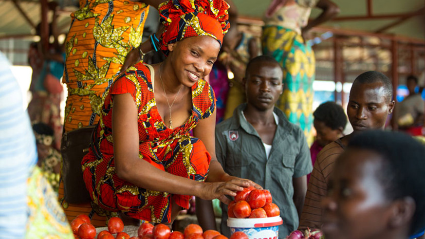 A vegetable vendor at her stall in Nyabugogo market. File photo