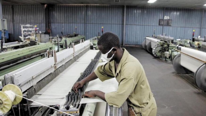 A worker at Utexrwa Textile Industry in Kigali. In East Africa, the budgets were read under one similar theme; u2018Industrialisation for Job Creation and Shared Prosperityu2019. File.
