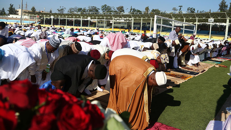 The Mufti of Rwanda, Sheikh Salim Hitimana leads Eid prayers at Kigali Regional Stadium yesterday.Sam Ngendahimana)