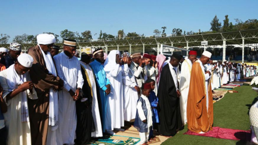 The Mufti of Rwanda, Sheikh Salim Hitimana leads Eid prayers at Kigali Regional Stadium yesterday.  Sam Ngendahimana.