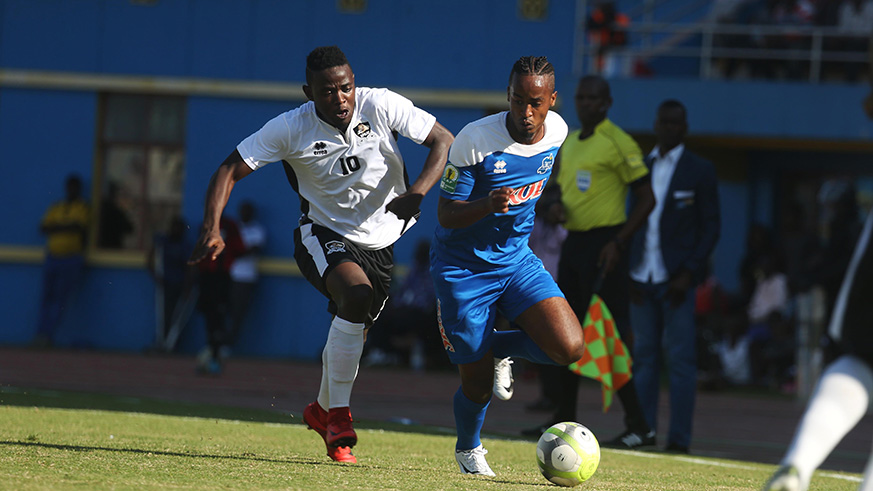 APRu2019s brace hero Muhadjiri Hakizimana (L) battles for the ball with Yannick Mukunzi during the 2-1 victory over Rayon Sports at Amahoro Stadium on Friday. Sam Ngendahimana.