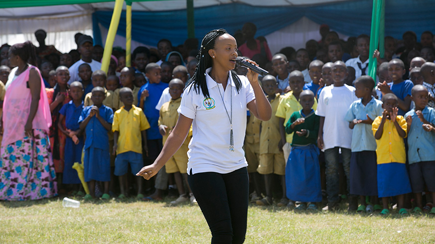 Butera Knowless entertaining the crowd during the celebration of the International Day of the African Child and the World Day Against Child Labour in Gakenke District