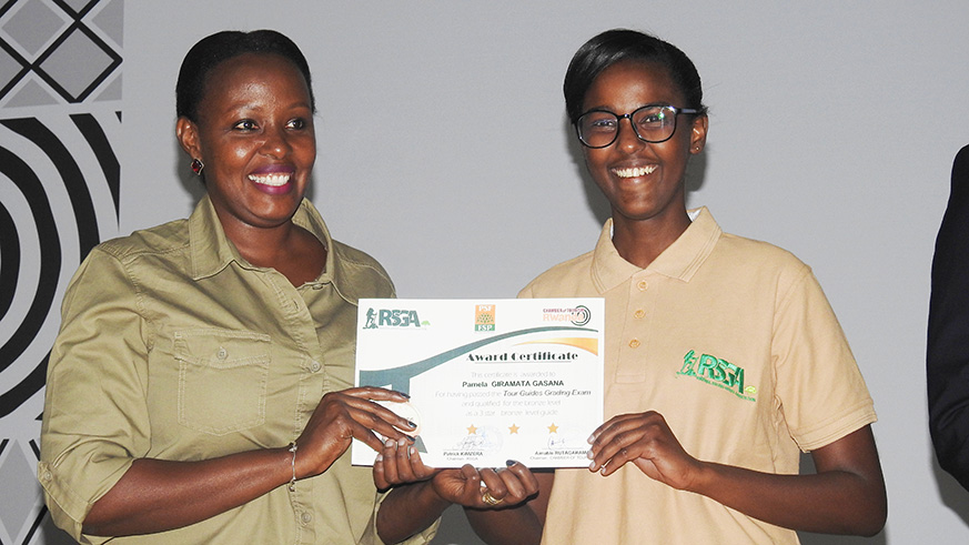 Pamela Giramata Gasana (R) receives her certificate. Frederic Byumvuhore.