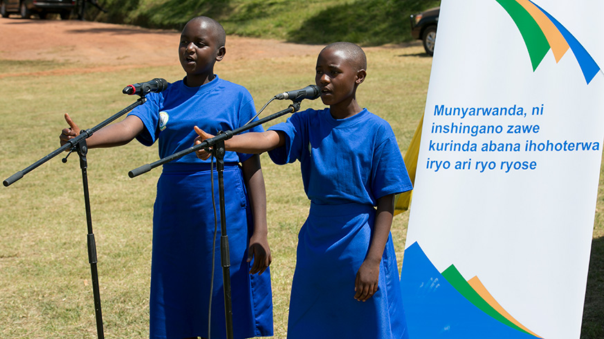 Young students recite a poem during the celebration of the International Day of the African Child and the World Day Against Child Labour in Gakenke District yesterday. Courtesy.