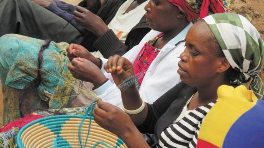 Ruhango District's Berwa Women's group members weave baskets. Such small projects have helped millions of rural poor to improve their livelihoods. (File)
