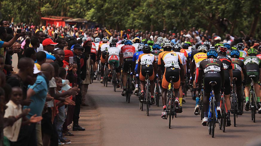 Tour du Rwanda 2017 riders in the peloton as cycling spectators cheer on them during Stage 6, FERWACY told the press that antidopping will be the priority in Tour du Rwanda 2018.  Sam Ngendahimana.