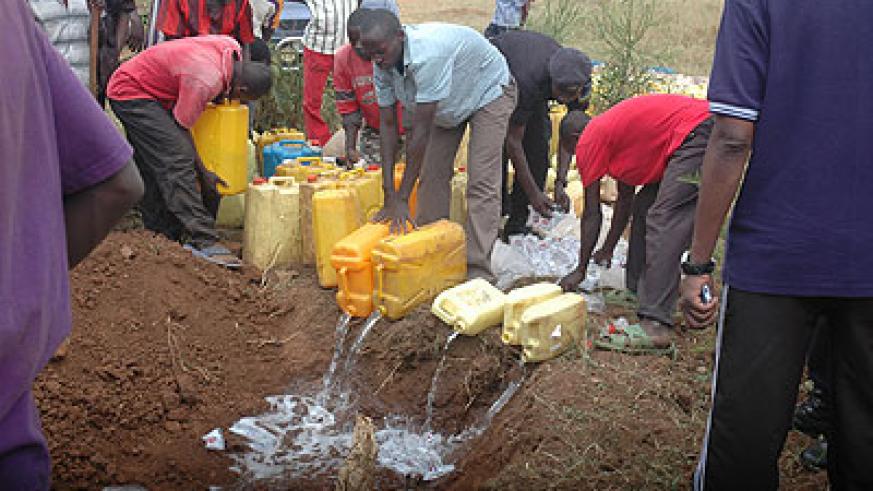 Residents destroying drugs. Proliferation of the illicit brew is rampant in the Eastern Province.