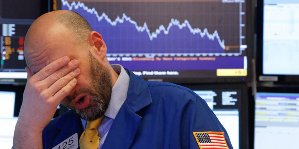 A trader reacts near the end of the day on the floor of the New York Stock Exchange in New York. Net.
