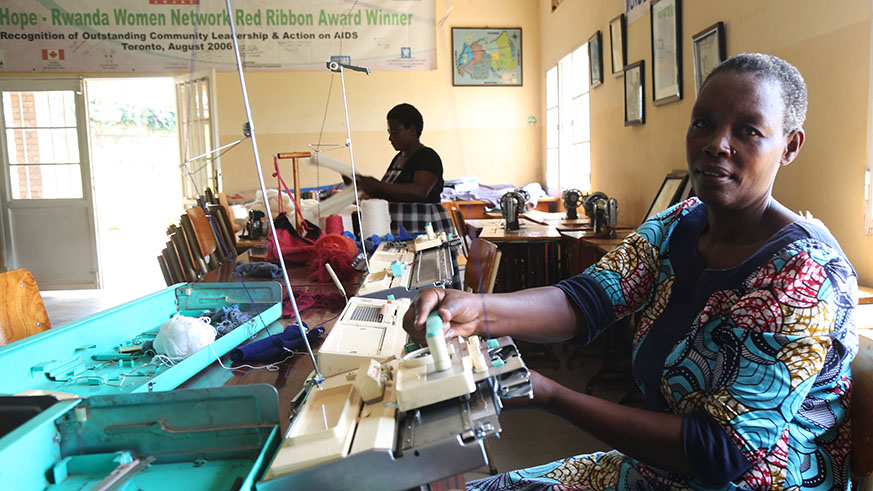 Eugenie Uwihoreye makes clothes at the Rwanda Women Network offices located in Kagugu. Photo (and cover) by Sam Ngendahimana