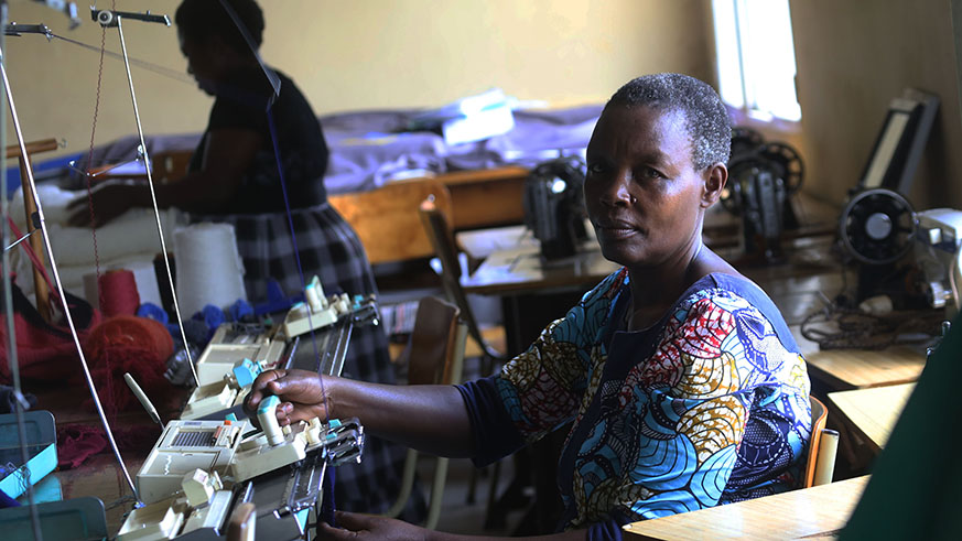 Eugenie Uwihoreye makes clothes at the Rwanda Women Network offices located in Kagugu. Photo (and cover) by Sam Ngendahimana