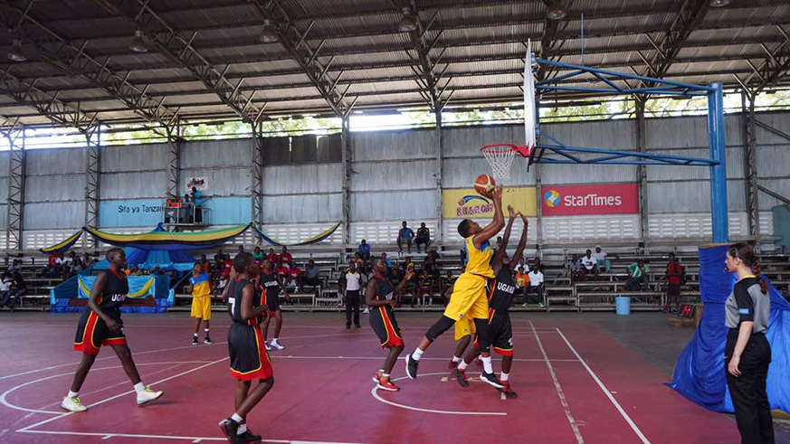 Center Hope Butera attempts to drop two points during their final encounter against Uganda yesterday at Uwanja wa taifa stadium.(Courtsey)