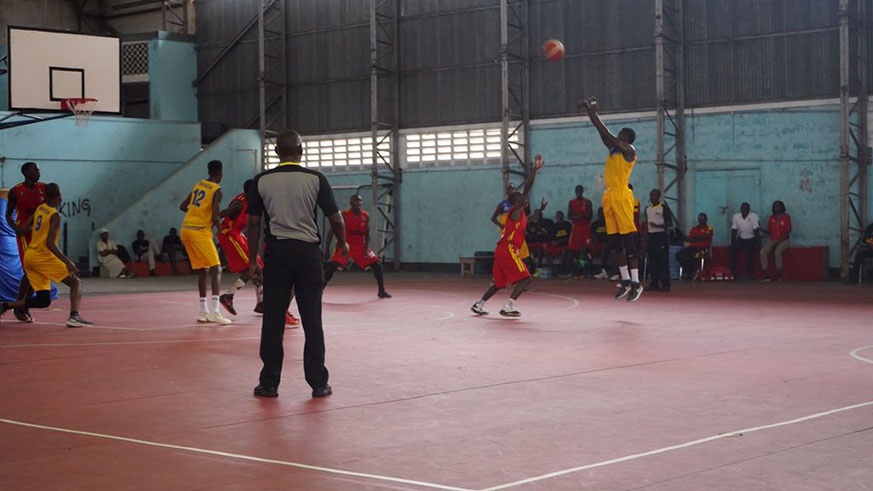 Rwanda's shooting guard Thierry Nkundwa tries a three-pointer shot during their encounter with Uganda at Uwanja wa Taifa indoor stadium yesterday. (Courtsey)